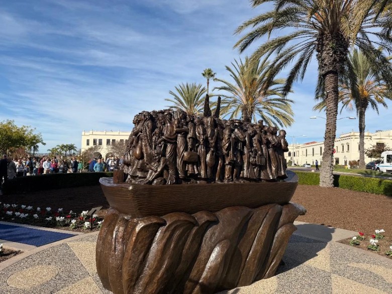 "Angels Unawares," a new sculpture on the campus of the University of San Diego (USD), was installed on Thursday, Dec. 18, 2025.  The 8-foot-tall bronze sculpture is a scaled version of one in St. Peter’s Square in Rome that was commissioned by Pope Francis in 2019 and depicts 140 migrants of varying backgrounds on board a boat with a pair of angel wings in their midst. Credit: Jim Graves