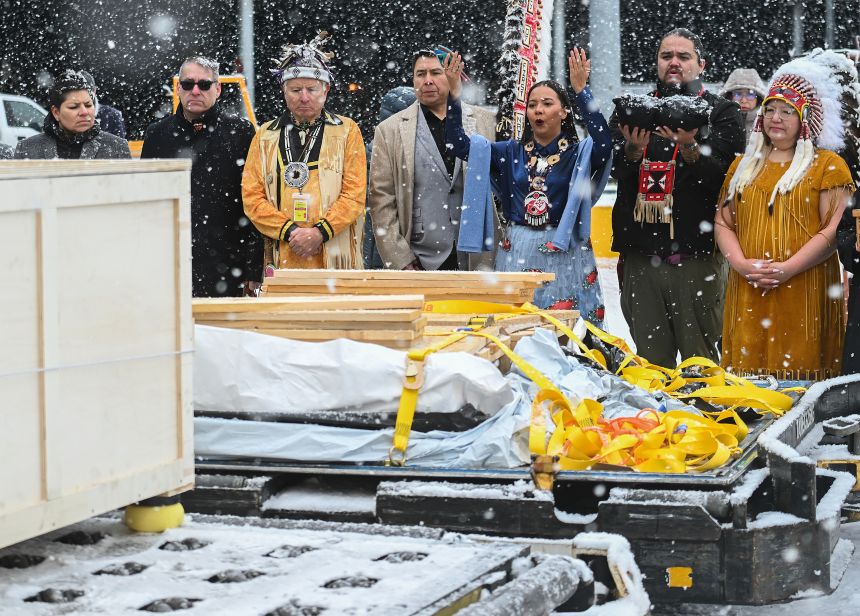Assembly of First Nations National Chief Cindy Woodhouse Nepinak, right, along with representatives from various First Nations receive a kayak and other indigenous artifacts at Trudeau Airport in Montreal, on Saturday, on December 6, 2025.