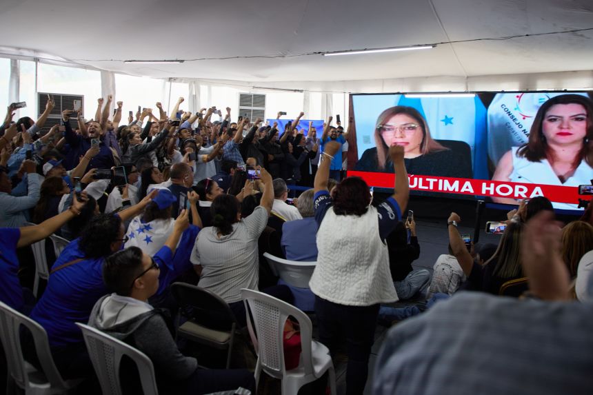 Supporters of the National Party celebrate as the National Electoral Council declares Nasry Asfura the presidential election winner in Tegucigalpa, Honduras, on December 24, 2025.