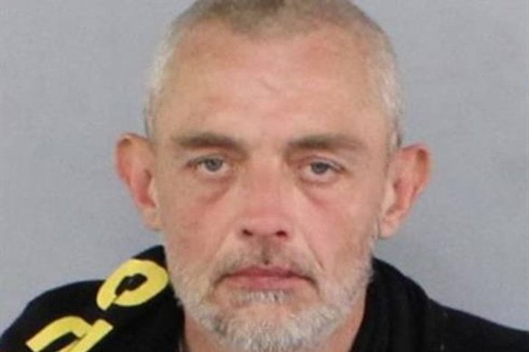 Police are searching for John Argento in relation to the firebombing of the car on Christmas morning.