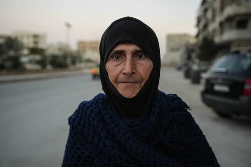 Hadiya, a 71-year-old Syrian woman who lives in a room in her destroyed house in Harasta. Moawia Atrash/dpa