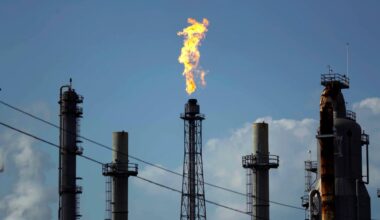 A flame burns at an oil refinery
