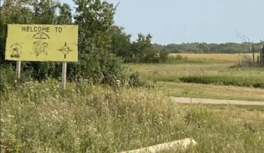 Yellow Welcome To James Smith Cree Nation sign.