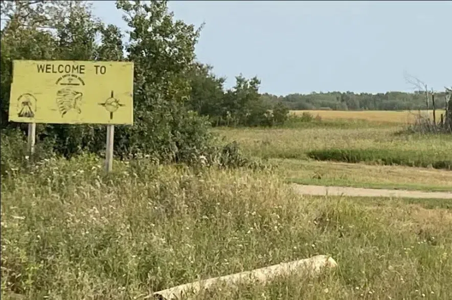 Yellow Welcome To James Smith Cree Nation sign.