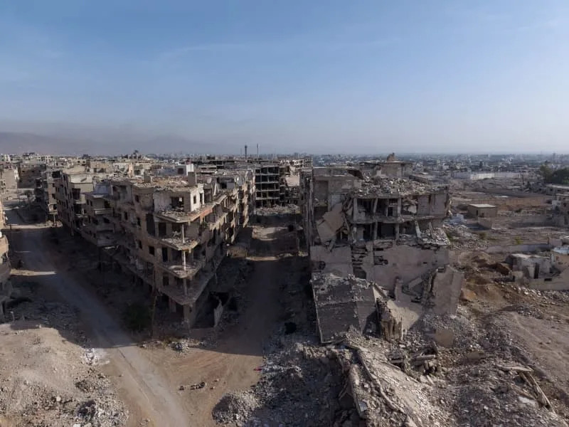 An aerial view shows the destruction to the city of Harasta, resulting in widespread poverty, damage to infrastructure and a collapse of services. Moawia Atrash/dpa