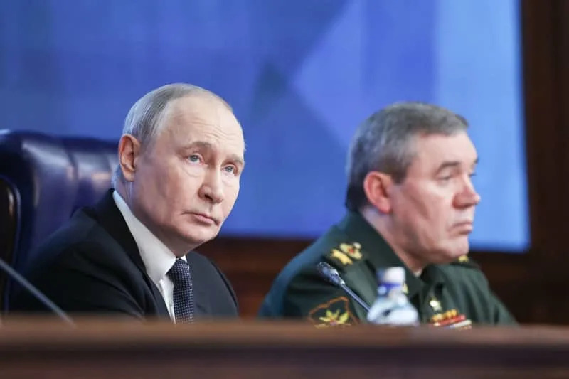 Russia's President Vladimir Putin (L) and Russia's First Deputy Defence Minister Valery Gerasimov, Chief of the General Staff of the Russian Armed Forces, attend an expanded meeting of the Defence Ministry Board. Alexander Kazakov/TASS via ZUMA Press/dpa
