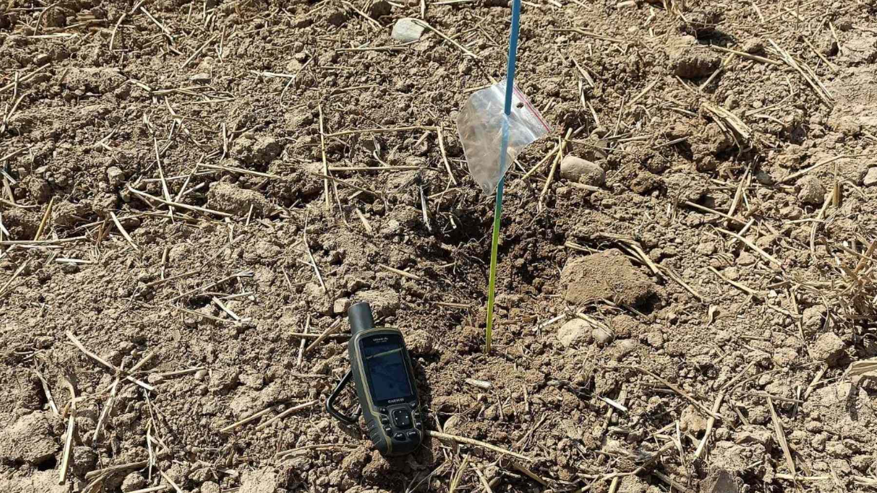 GPS device next to a flagged marker in a ploughed field at the western Czech site where 2,500-year-old Celtic treasure was found.