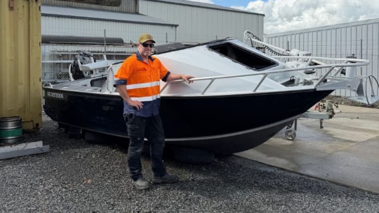 Teague and his boat.