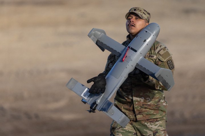 A US soldier holds an interception drone of the American MEROPS counter drone system during tests at the Nowa Deba military training ground, south-eastern Poland, on November 18, 2025. (Photo by WOJTEK RADWANSKI/AFP via Getty Images) A US soldier holds an interception drone of the American MEROPS counter drone system during tests at the Nowa Deba military training ground, south-eastern Poland, on November 18, 2025. (Photo by WOJTEK RADWANSKI/AFP via Getty Images)