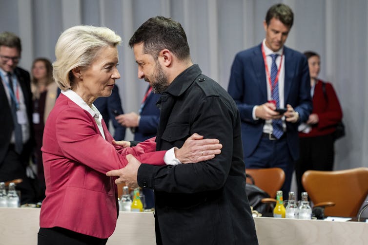 EU commission president, Ursula von der Leyen greets Ukrainian president Volodymyr Zelensky.