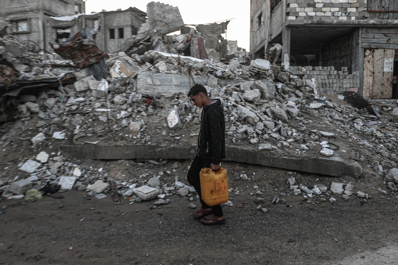 Palestinians in the Bureij Refugee Camp are trying to carry on with their daily lives under harsh conditions amid the rubble caused by Israeli attacks in Bureij, Gaza on Dec. 20, 2025. (AA Photo)