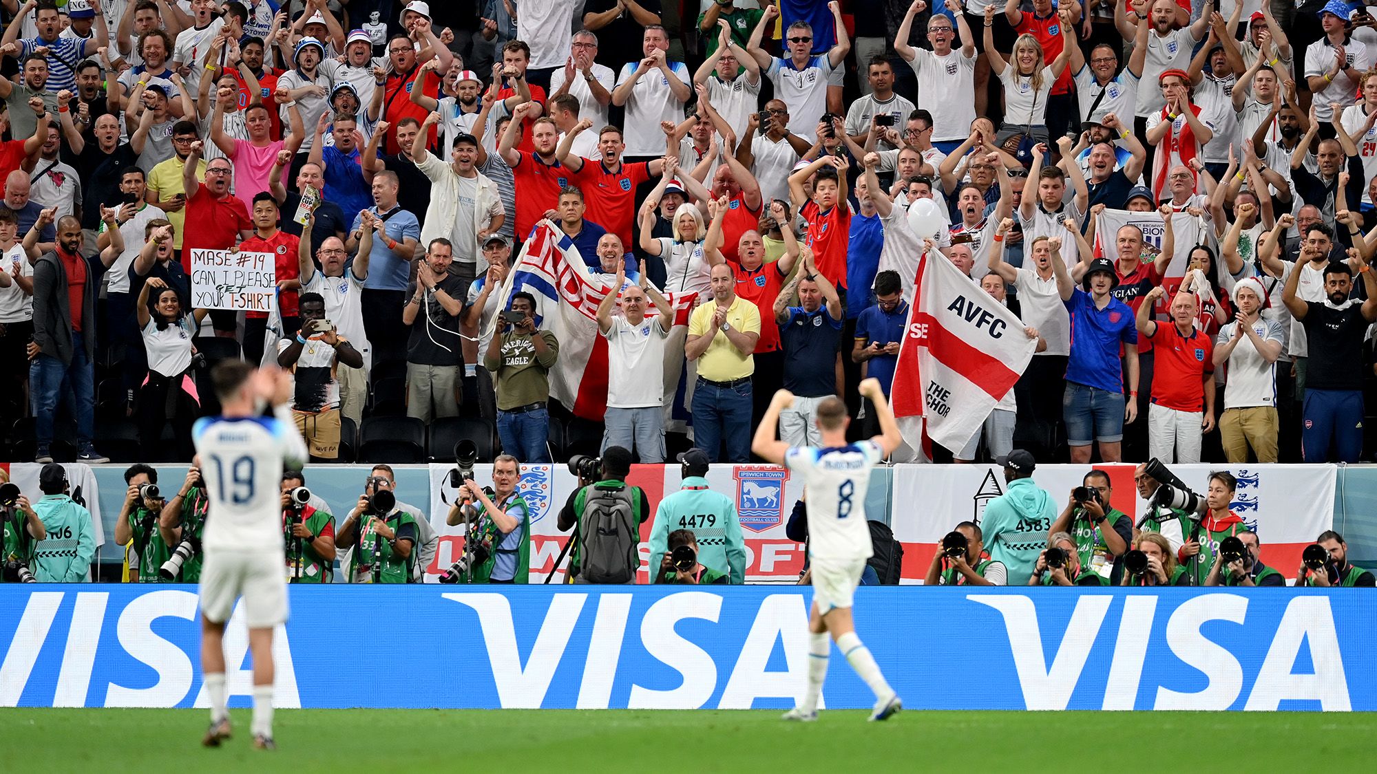 AL KHOR, QATAR - DECEMBER 04: England fans celebrate after the team's victory during the FIFA World Cup Qatar 2022 Round of 16 match between England and Senegal at Al Bayt Stadium on December 04, 2022 in Al Khor, Qatar. (Photo by Dan Mullan/Getty Images)