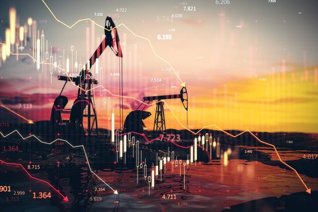 Oil pumpjacks at sunset with financial charts overlay.