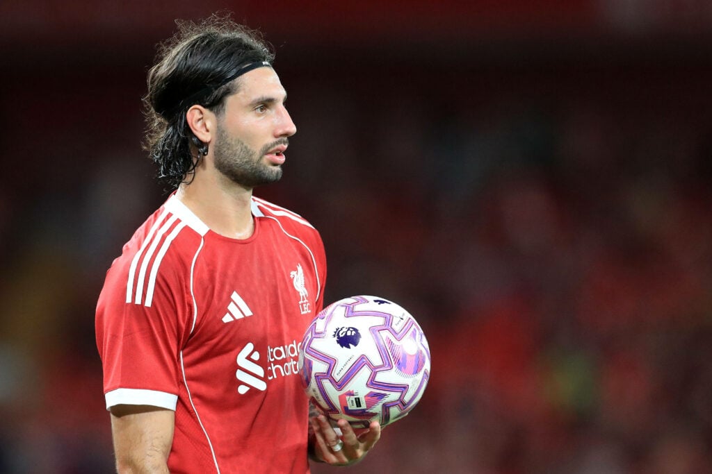 Dominik Szoboszlai looking focused for Liverpool holding a ball