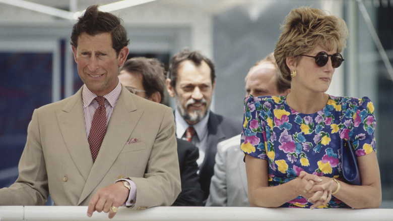 Princess Diana looking away from King Charles III