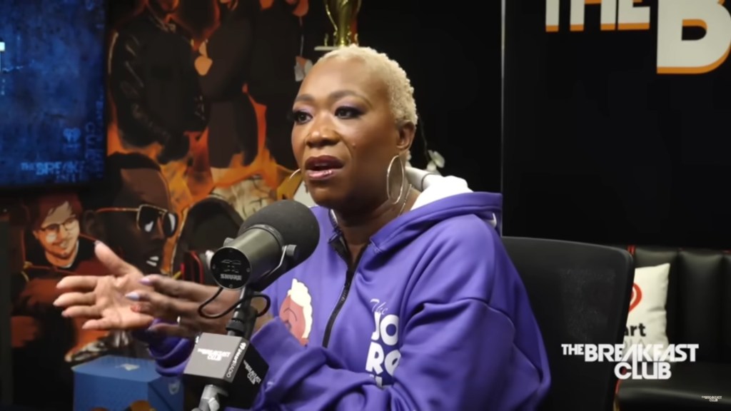 Joy Reid speaking into a microphone.