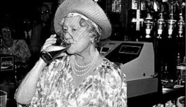 The queen mum sucks one back in Limehouse, 1987.