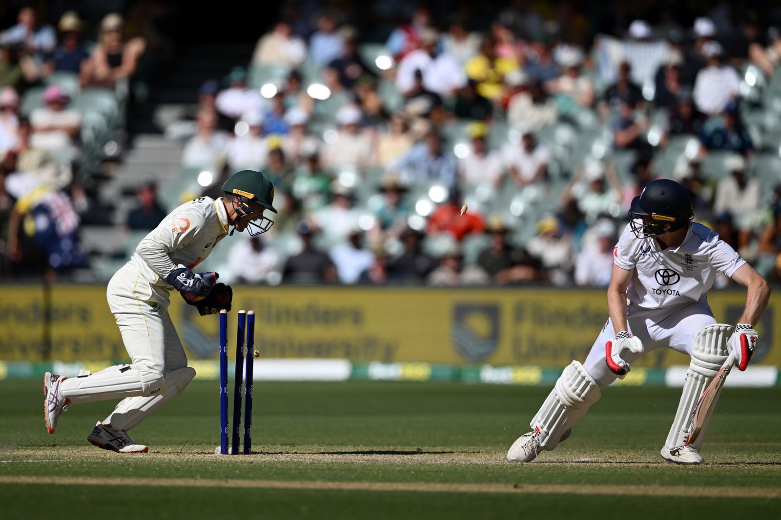 A wicketkeeper stumps a batter