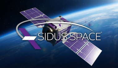 Sidus Space satellite with purple solar arrays orbits above Earth, reflecting the company’s focus on space-based data.