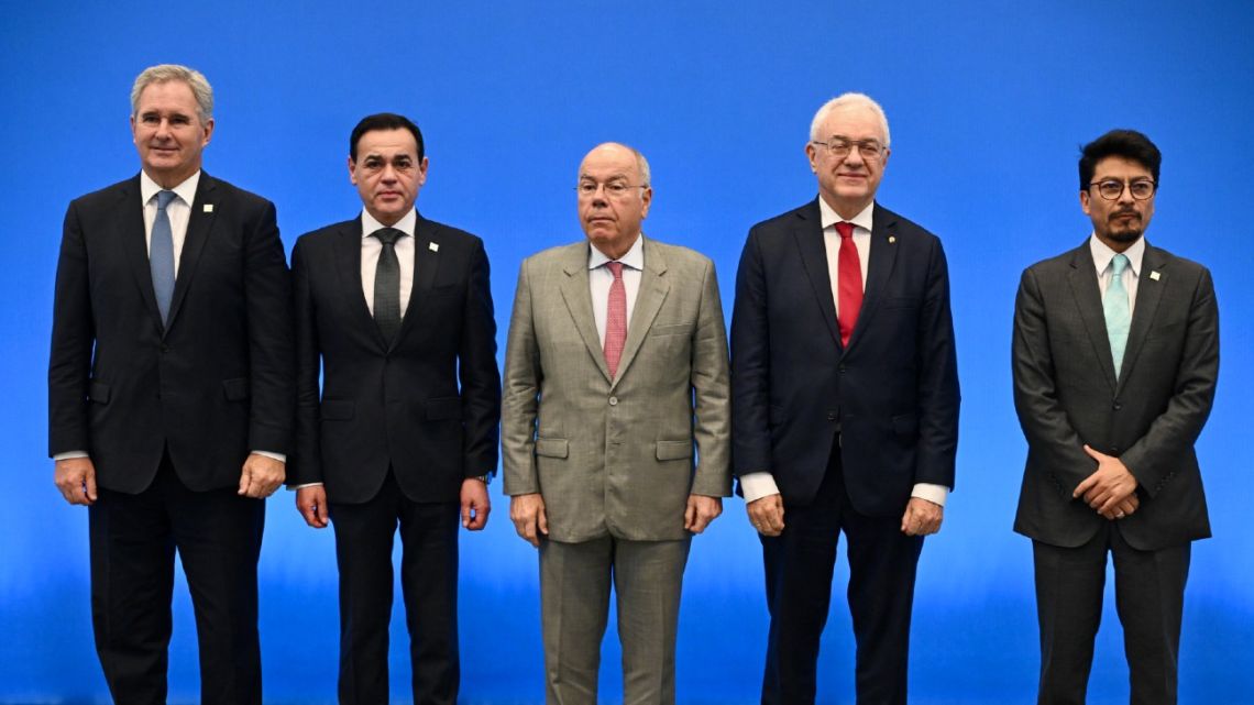 Argentina's Foreign Minister Pablo Quirno, Paraguay's Foreign Minister Ruben Ramirez, Brazil's Foreign Minister Mauro Vieira, Uruguay's Foreign Minister Mario Lubetkin and Bolivia's Foreign Minister Fernando Aramayo, pose for a family photo of the Mercosur Economic Bloc Foreign Ministers Meeting in Foz do Iguacu, Parana State, Brazil, on December 19, 2025. Representatives of the South American Mercosur trade bloc began meeting Friday in Brazil after plans to sign a long-delayed deal with the EU fell through.