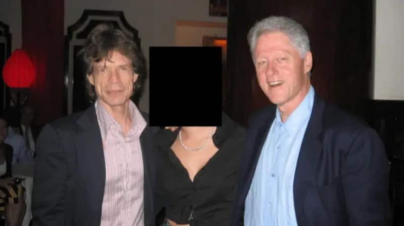 Mich Jaggr with Bill Clinton and a woman whose face is redacted