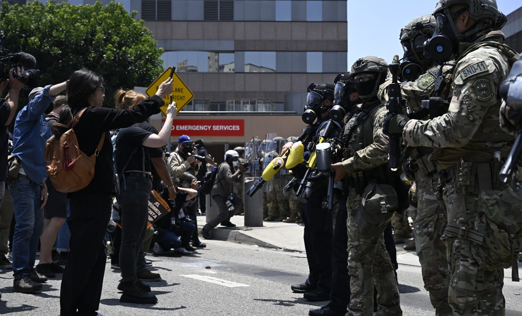 ICE officers and National Guard soldiers stand outside of the Metropolitan Detention Center in Los Angeles, California on June 8, 2025. (Tayfun Coskun/Anadolu via Getty Images)