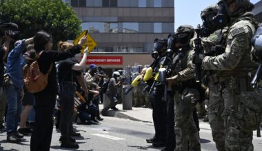ICE officers and National Guard soldiers stand outside of the Metropolitan Detention Center in Los Angeles, California on June 8, 2025. (Tayfun Coskun/Anadolu via Getty Images)
