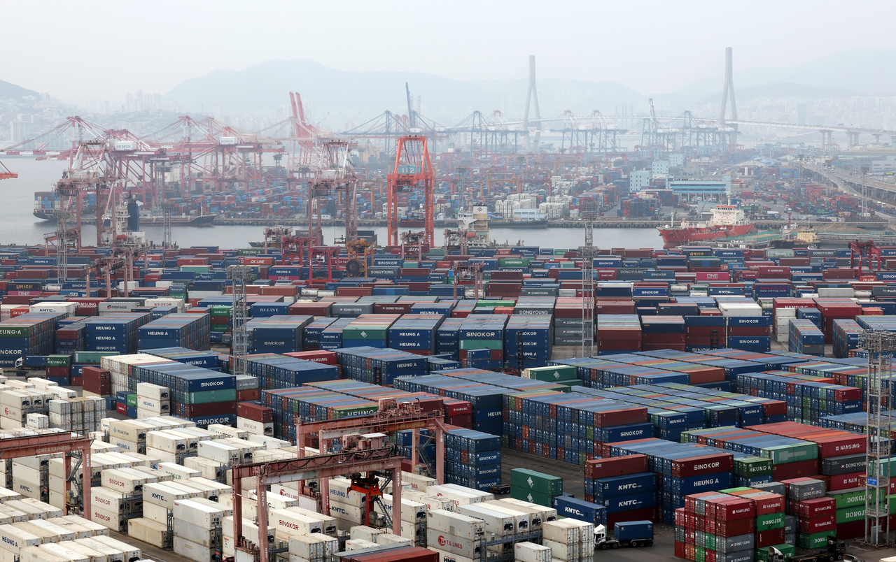 Containers are stacked in the port city of Busan, Monday. (Yonahp)