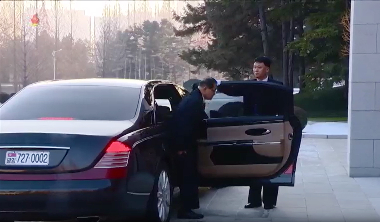 This image, captured from footage of North Korea's state-run TV station, shows Premier Pak Thae-song getting off a vehicle bearing the license plate "7·27 0002" to attend an enlarged plenary meeting of the ruling Workers' Party of Korea on Dec. 11. (Yonhap)