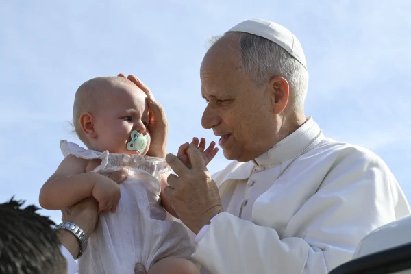 Pope Leo XIV blesses a baby during the general audience on Sept. 3, 2025, in St. Peter’s Square at the Vatican. Credit: Vatican Media