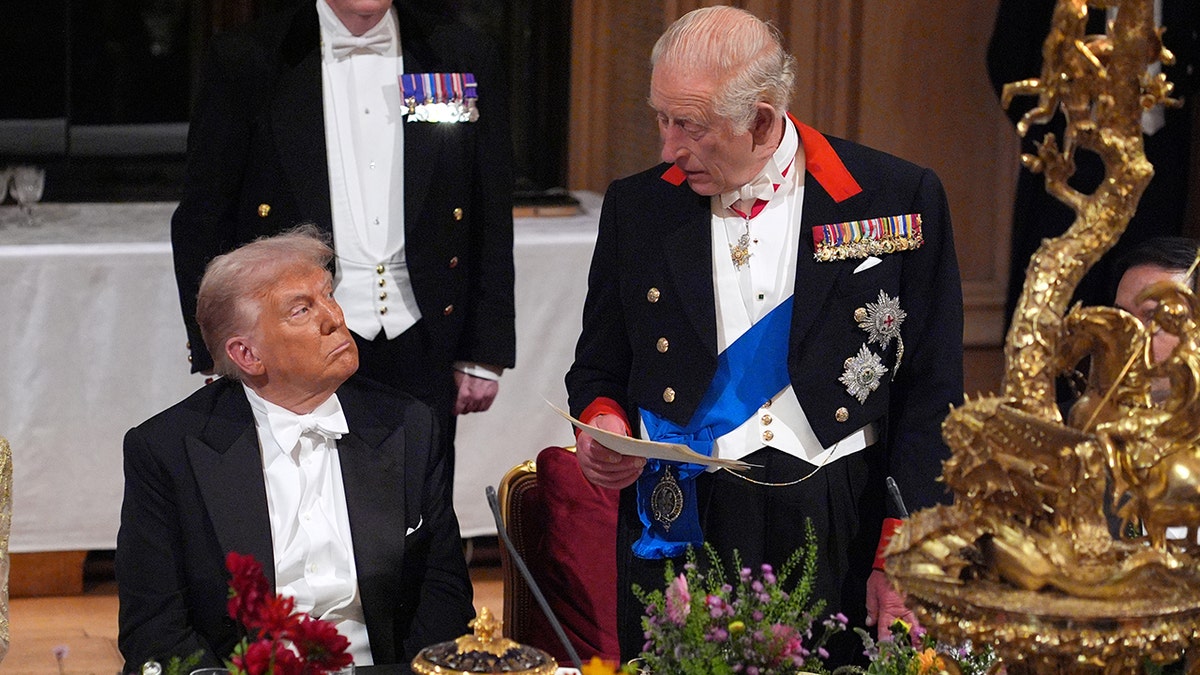President Trump and King Charles looking at one another as Charles speaks.