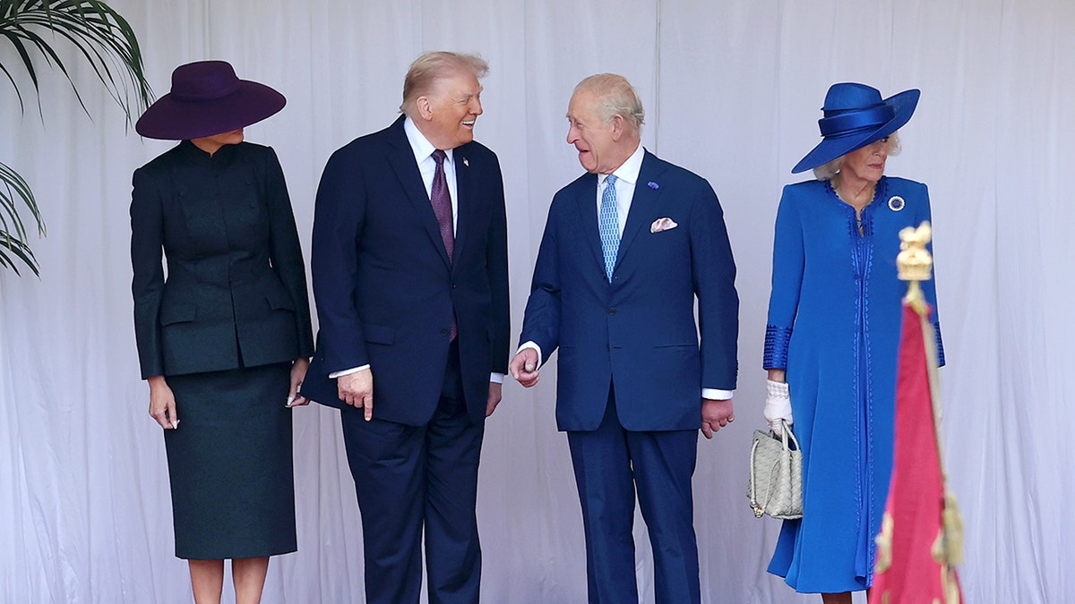 Donald Trump sharing a laugh with King Charles III as their wives look on.