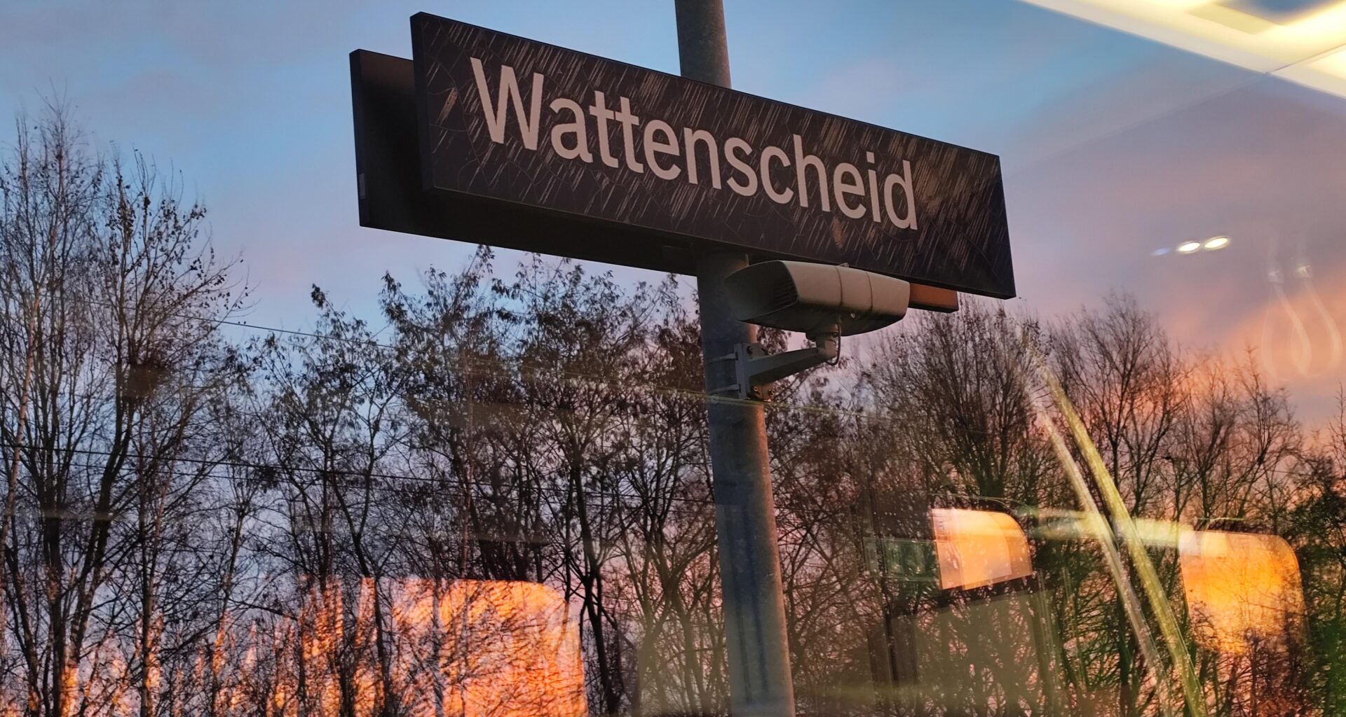 What caused these white marks on the sign?