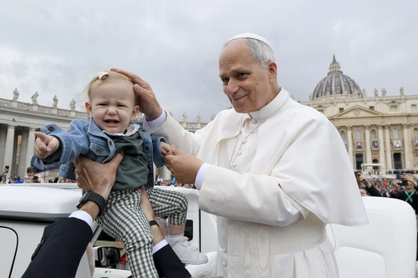 Pope Leo XIV greets a baby during his general audience in St. Peter's Square at the Vatican, Wednesday, Oct. 22, 2025. Credit: Vatican Media