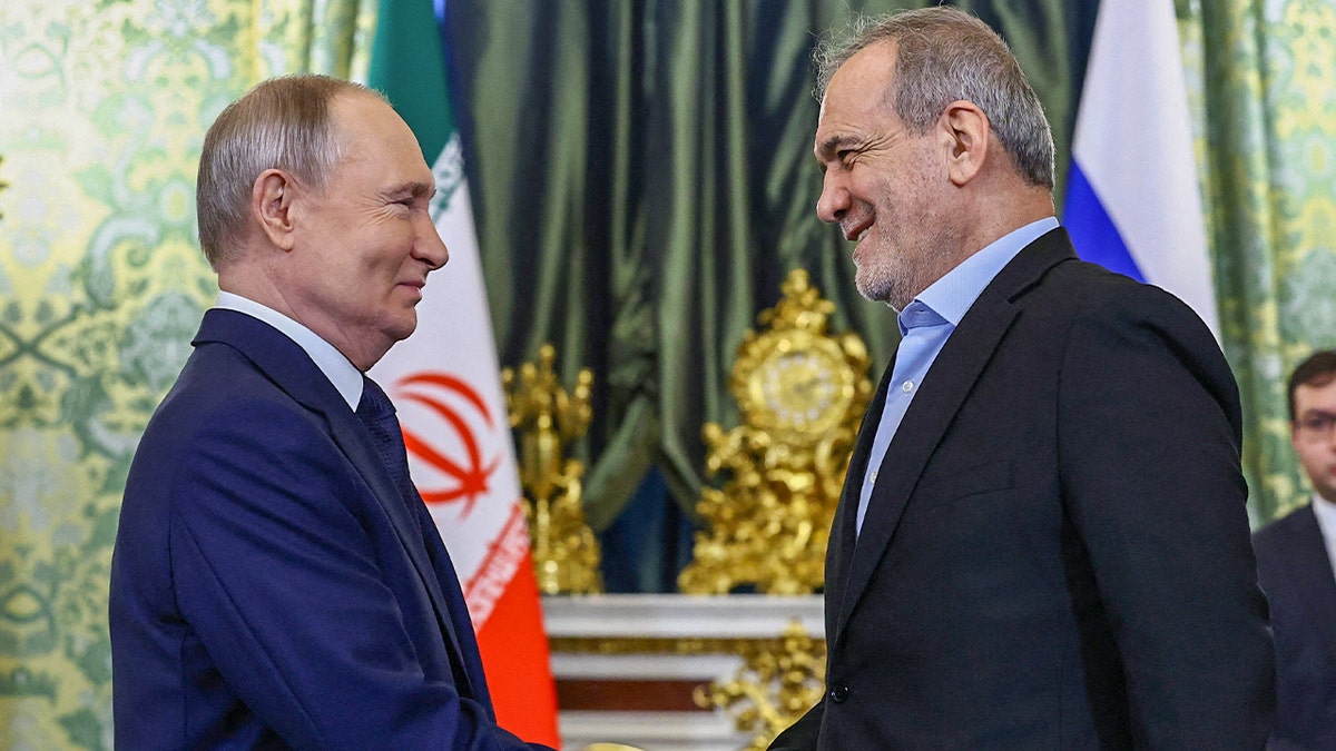 Russian President Vladimir Putin and Iranian President Masoud Pezeshkian shake hands as they meet in Moscow, Russia Jan. 17, 2025.