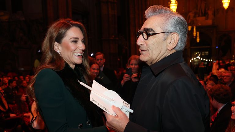 Kate speaks with Eugene Levy at Westminster Abbey. Pic: AP