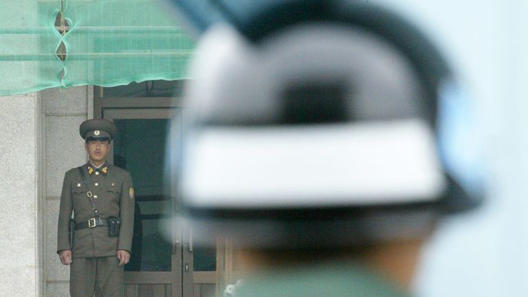 North and South Korean soldiers face off across the demilitarised zone at their shared border. Pic: Reuters