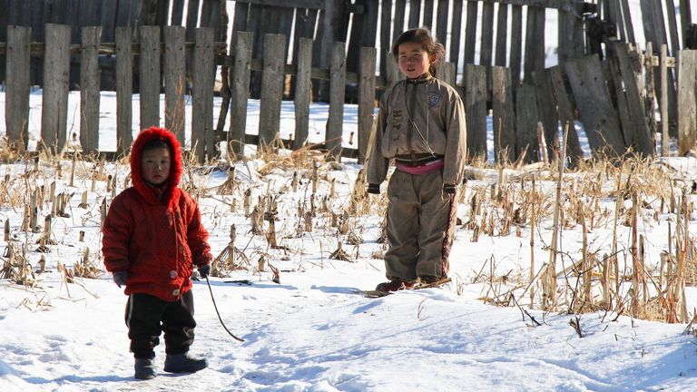 North Korean children stand on the banks of the Yalu River that marks the border with China. File pic: Reuters