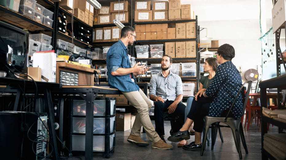 Workers gather at a small business