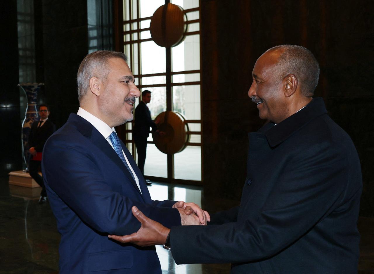 Sudan's army chief General Abdel Fattah al-Burhan (R) shaking hands with Türkiye's Foreign Minister Hakan Fidan (L) at the Presidential Complex in Ankara, Türkiye on Dec. 25, 2025. (AFP Photo)