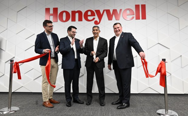 Officials cut the ribbon for Honeywell's new office Friday, Dec. 19, 2025, in Upper Macungie Township. The company unveiled the office for its new liquefied natural gas division at the site that formerly housed Air Products' LNG process technology and equipment business. (Amy Shortell / The Morning Call)