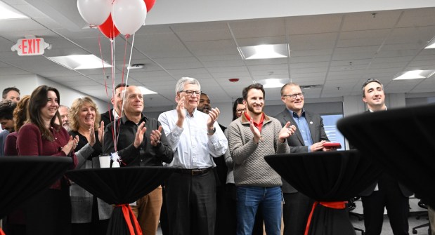 Honeywell employees applaud during a ribbon-cutting ceremony Friday, Dec. 19, 2025, in Upper Macungie Township. The company unveiled offices for its new liquefied natural gas division at the site that formerly housed Air Products' LNG process technology and equipment business. (Amy Shortell / The Morning Call)