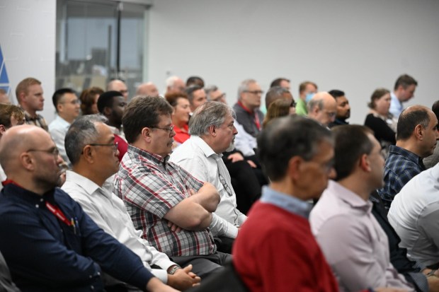 Employees listen as Vimal Kapur is Chairman and CEO of Honeywell,  speaks during the opening of Honeywell's new office Friday, Dec. 19, 2025, in Upper Macungie Township. The company unveiled offices for its new liquefied natural gas division at the site that formerly housed Air Products' LNG process technology and equipment business. (Amy Shortell / The Morning Call)