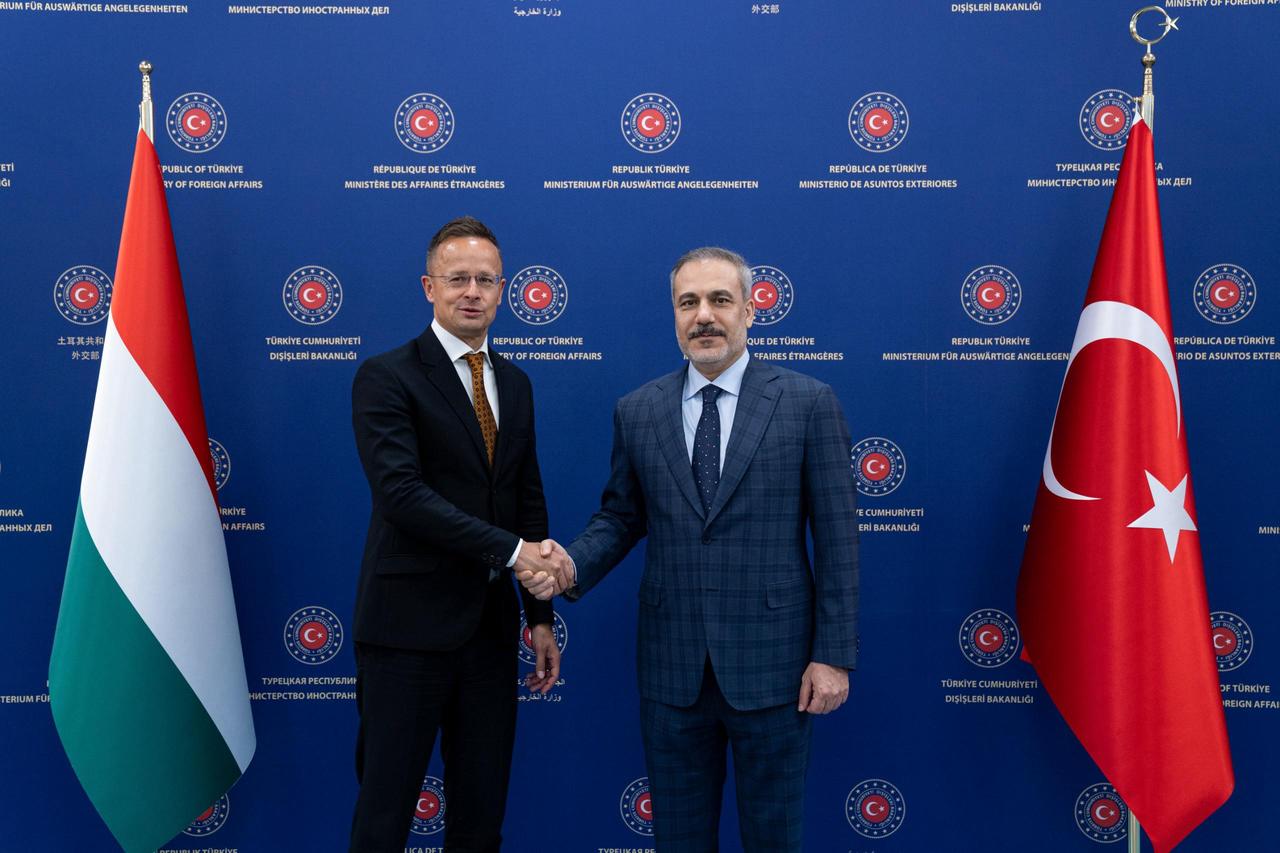 Turkish Foreign Minister Hakan Fidan (R) shakes hand with Hungarian Deputy Minister of Foreign Affairs and Trade Peter Szijjarto (L) ahead of their meeting in Ankara, Türkiye on June 26, 2025. (AA Photo)
