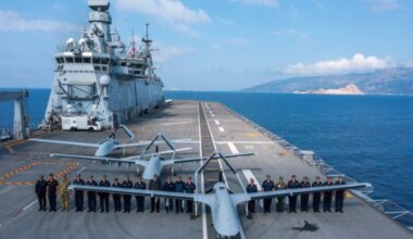 Three Bayraktar TB3 drones and military personnel stand on board TCG Anadolu during Baykar Distinguished Observer Day of the SEAWOLF 2025 Exercise in Antalya, Türkiye on May 14, 2025. (Baykar)