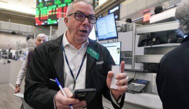 Wall Street rises to the edge of its all-time high