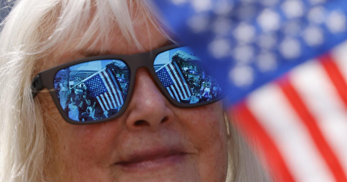 Hundreds rally against immigration raids, budget bill in downtown L.A.