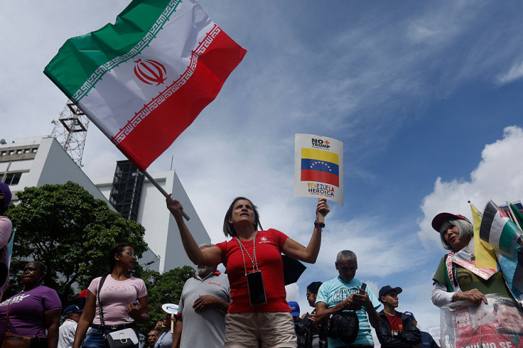 A Venezuelan woman waves an Iranian flag in Caracas