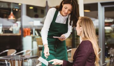 woman taking a request at a restaurant table
