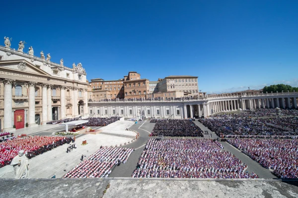 An aerial view of St. Peter's Square filled with thousands of mourners, clergy, and dignitaries gathered for Pope Francis' funeral Mass under clear blue skies in Vatican City on April 26, 2025. Credit: Daniel Ibáñez/CNA